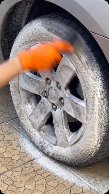Same wheel covered in foam, scrubbed with a brush